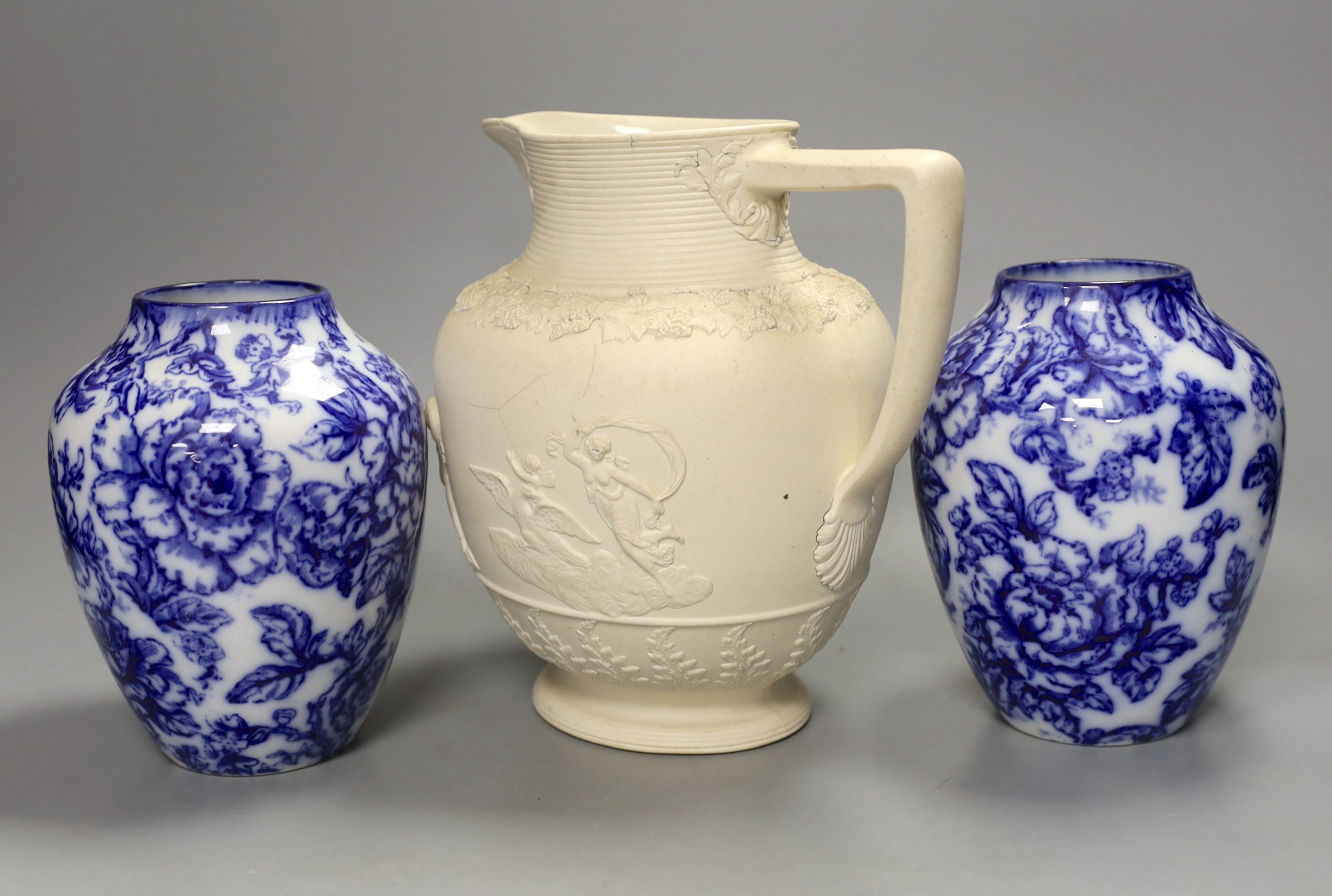 A pair of Keelings blue and white floral vases and a 19th century relief moulded white stoneware jug, vases 17 cms high.